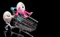 Two funny eggs ride a cart Royalty Free Stock Photo