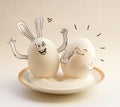 Two funny eggs on a saucer smiling. Happy Easter Royalty Free Stock Photo