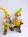 Two funny garden dwarfs with hoe and shovel isolated on white background Royalty Free Stock Photo