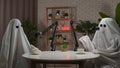 Two funny ghosts record a podcast in a studio Royalty Free Stock Photo