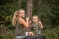 two funny girls swing on a swing