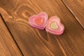 Two funny hearts on wooden background. The concept of Valentine`s day Royalty Free Stock Photo