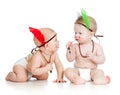 Two funny little children as Indian in diapers