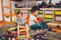 Two funny and messy baby brothers playing together Royalty Free Stock Photo