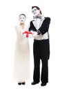 Two funny mimes with gift box in studio on white Royalty Free Stock Photo