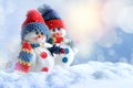 Two funny snowmen in winter on the snow