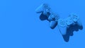 Two gamepads on blue background. Gaming controllers abstract background