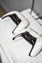 Two gaming controllers on a console set up for play Royalty Free Stock Photo
