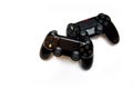 Two gaming controllers for playing video games on a white background Royalty Free Stock Photo