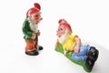 Two garden gnomes, lying and standing