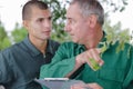two gardeners talking about plants Royalty Free Stock Photo