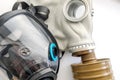 Two gas masks are next to each other on a white background