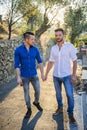 Two gays in park hand in hand Royalty Free Stock Photo