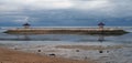 Two gazebo at the beach of Sanur. Storm clouds in the background