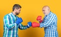 two generation men boxing isolated on yellow. generation men boxing in studio.