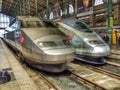 Two genrations of TGV HST trains: Reseau and TMST at Gare du Nord in Paris in France. Royalty Free Stock Photo