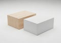 Two geometric blocks one light wood and one white positioned against a plain background Royalty Free Stock Photo