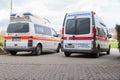 Two german ambulance vehicles stands on hospital