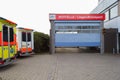 Two german ambulance vehicles stands on hospital