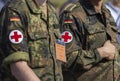 two german army soldiers with a red cross brassard Royalty Free Stock Photo