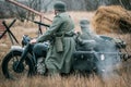 Two German soldiers of the Wehrmacht on a motorcycle