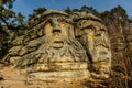 Two giant heads of devils carved into sandstone rocks,each is about 9m high.Devils Heads created by Vaclav Levy near