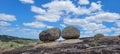 two giant rocks on top of a mountain. Blue sky with clouds in the background. Cabeceiras, Paraiba, Northeast Brazil