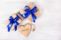 Two gift boxes with blue ribbons and valentines on a white background. Valentine`s Day. Copy space Royalty Free Stock Photo