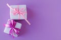 Two gift boxes with pink and purple white polka dot ribbon bows Royalty Free Stock Photo