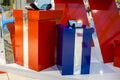 Two gift boxes red and blue metallic shiny with silver bows, decoration for the holiday. Christmas and New Year. close Royalty Free Stock Photo