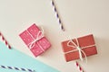 Two gift boxes wrapped in color purple and red polka dots paper on pink background Royalty Free Stock Photo