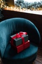 Two gift boxes wrapped with red ribbon on a chair Royalty Free Stock Photo