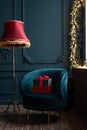 Two gift boxes wrapped with red ribbon on a chair by a window Royalty Free Stock Photo