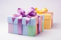 Two gift multi-colored boxes with bright ribbons and bows on a white background