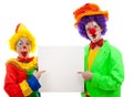 Two girl clowns holding empty text board Royalty Free Stock Photo