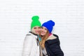 Two girl couple smile wear winter colorful hats jacket