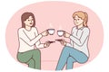 Two girl friends drink hot coffee holding cups and saucers enjoy joint coffeebreak