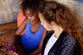 Two girl friends looking at cell phone Royalty Free Stock Photo