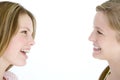 Two girl friends looking at each other smiling Royalty Free Stock Photo