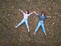 Two girl lying in the grass aerial Royalty Free Stock Photo