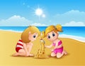 Two girl making sand castle at the beach