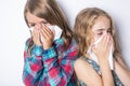 Girl sneeze with napkin paper on white background Royalty Free Stock Photo