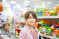 Girl in toy store choosing toys Royalty Free Stock Photo