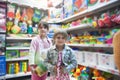 Two sisters in toy store Royalty Free Stock Photo