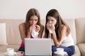 Two girlfriends crying while watching sad movie Royalty Free Stock Photo
