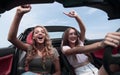 Two girlfriends enjoying a trip in the car Royalty Free Stock Photo