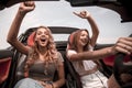 Two girlfriends enjoying a trip in the car Royalty Free Stock Photo