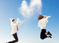 Two girlfriends have fun and enjoy fresh snow Royalty Free Stock Photo