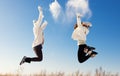 Two girlfriends have fun and enjoy fresh snow Royalty Free Stock Photo