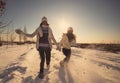 Two girlfriends have fun and enjoy fresh snow Royalty Free Stock Photo